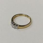 A large 18 carat yellow gold three stone ring in c