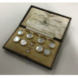 A cased set of 9 carat cufflinks together with mat