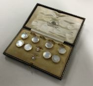 A cased set of 9 carat cufflinks together with mat