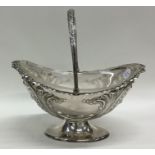 An Edwardian silver plated basket with glass liner