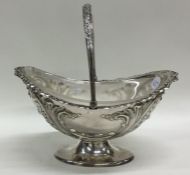 An Edwardian silver plated basket with glass liner