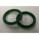 Two green hardstone bangles. Approx. 111 grams. Es