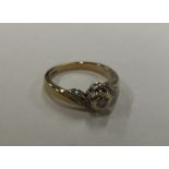 A diamond mounted 9 carat crossover ring. Approx.