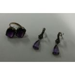 An amethyst two stone crossover ring set in gold t