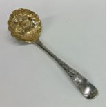 An 18th Century silver and silver gilt berry ladle
