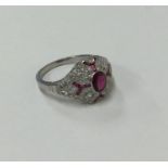 An attractive ruby and diamond Art Deco style clus