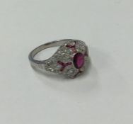 An attractive ruby and diamond Art Deco style clus