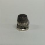 A Stratford-Upon-Avon silver mounted thimble. Appr