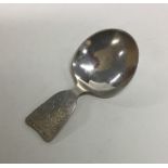 A Danish silver caddy spoon with floral decoration