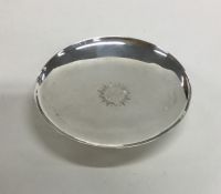 A silver communion plate on pedestal base. Sheffie