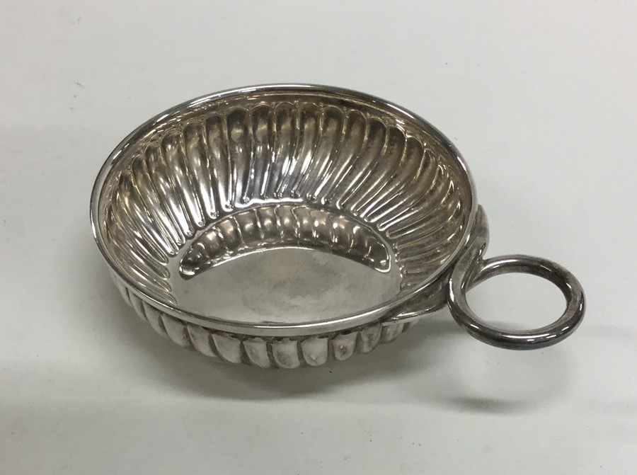 A Continental silver bleeding bowl of half fluted