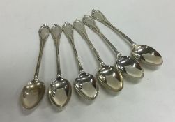 A large set of six silver lily pattern teaspoons.