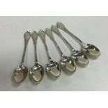 A large set of six silver lily pattern teaspoons.