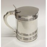 An 18th Century lidded tankard with reeded body to