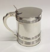 An 18th Century lidded tankard with reeded body to