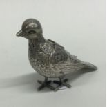 A rare cast figure of a bird with hinged silver wi