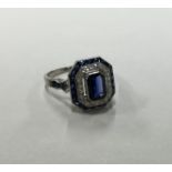 An attractive sapphire and diamond cluster ring wi