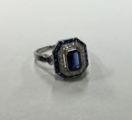 An attractive sapphire and diamond cluster ring wi