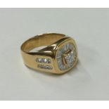 A large gent's signet ring decorated with numerous