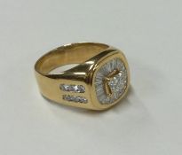 A large gent's signet ring decorated with numerous