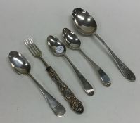 An Edwardian silver spoon together with other silv