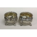 A pair of heavy good quality cast silver salts on