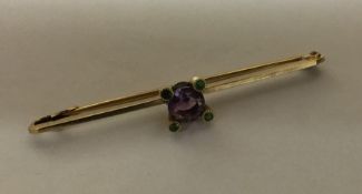 An amethyst and demantoid garnet brooch. Approx. 3