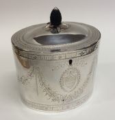 A good quality George III bright cut silver tea ca