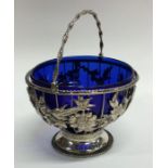 A good Georgian pierced silver sugar basket decora