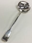 A large fiddle pattern silver soup ladle with cres