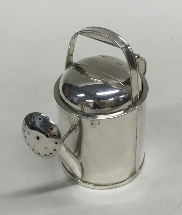 A novelty heavy silver watering can with spring me