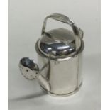 A novelty heavy silver watering can with spring me