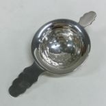 An Edwardian silver tea strainer. Birmingham. Appr