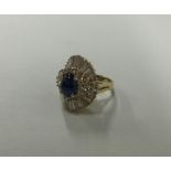 A large 3 carat cabochon sapphire and diamond clus