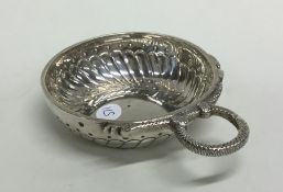 An 18th Century silver wine taster of typical form