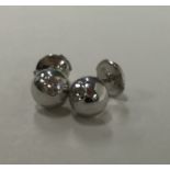 CARTIER: A pair of heavy diamond mounted ear studs