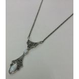 An unusual silver and marcasite pendant on fine li