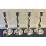 A rare set of four Georgian silver candlesticks wi