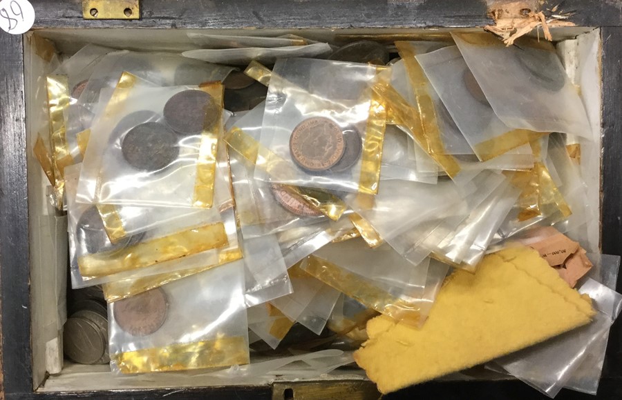 A box containing copper and other coinage. Est. £1
