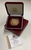 A Queen Elizabeth II Jersey proof £5 gold coin. Es