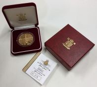 A Queen Elizabeth Alderney proof £5 gold coin. Est