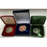 Three cased nickel commemorative coins. Est. £10 -
