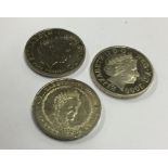 A group of three £5 coins. Est. £10 - £20.