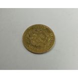 A gold French 10 Franc coin. Approx. 3.2 grams. Es