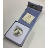 A cased proof silver Canadian $100 coin. Est. £10