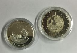 Two proof £5 coins. Est. £10 - £20.