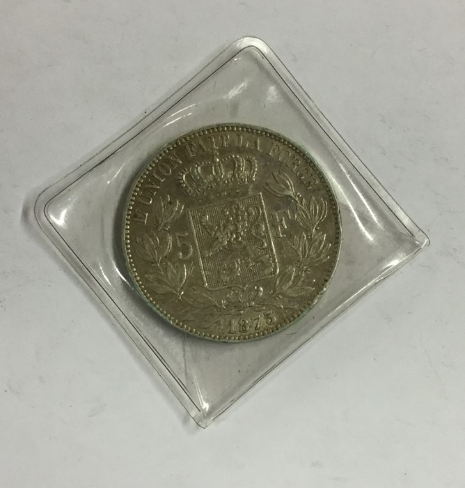 An 1873 silver 5 Franc coin. Est. £15 - £20.