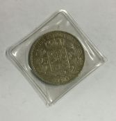 An 1873 silver 5 Franc coin. Est. £15 - £20.