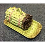 An unusual asparagus dish and cover on matching tr