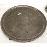 A large Georgian silver circular salver with crest